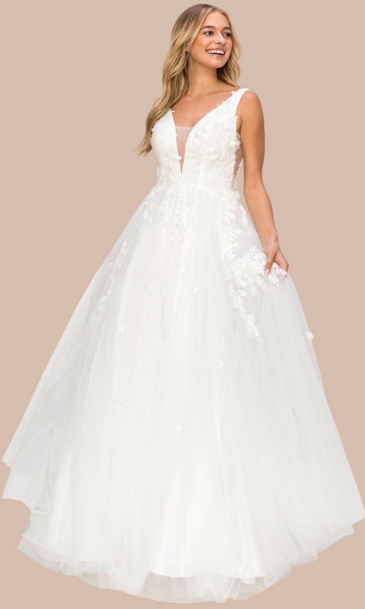 A woman stands against a plain beige background wearing the Cinderella Couture 8040J long formal dress—a sleeveless white gown featuring a deep V-neckline, 3D floral lace appliques on the bodice, and a full tulle skirt.